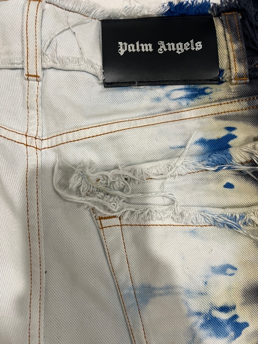 Palm Angels Men’s White Denim Jeans with Blue Stain and Distressed Detail